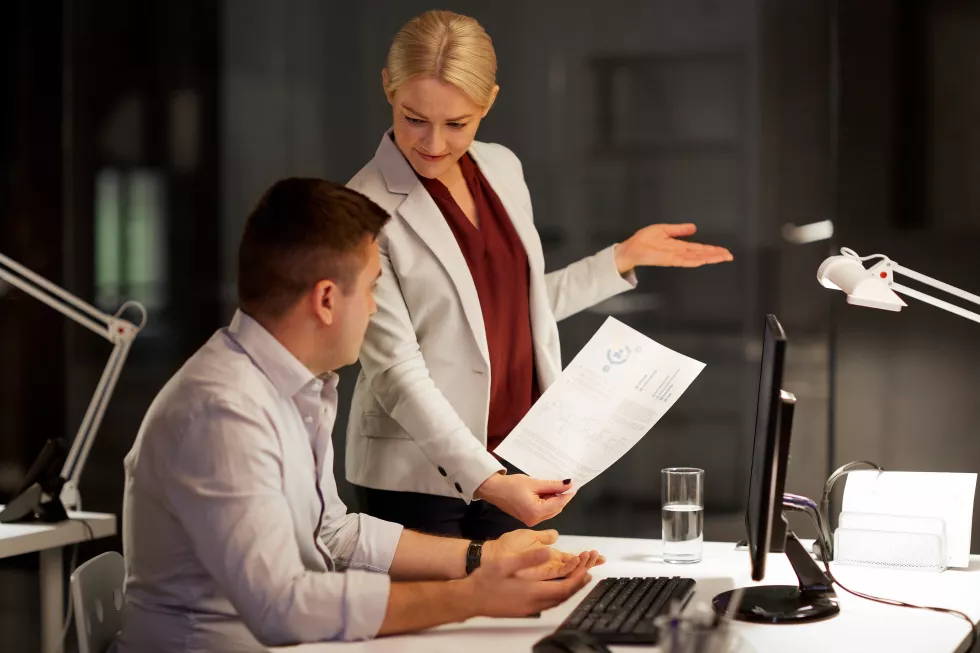 business-team-with-papers-working-late-office