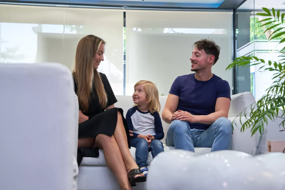 mother-father-look-each-other-while-their-son-is-looking-grim