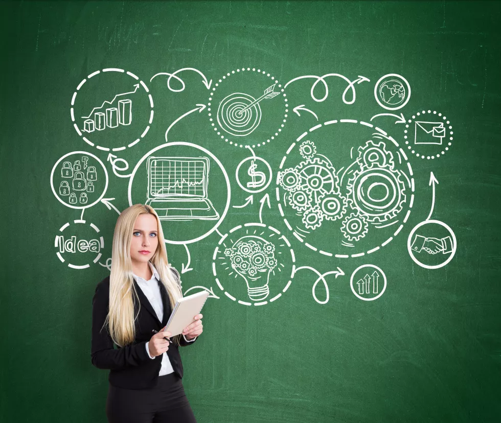 businesswoman-with-charts-blackboard