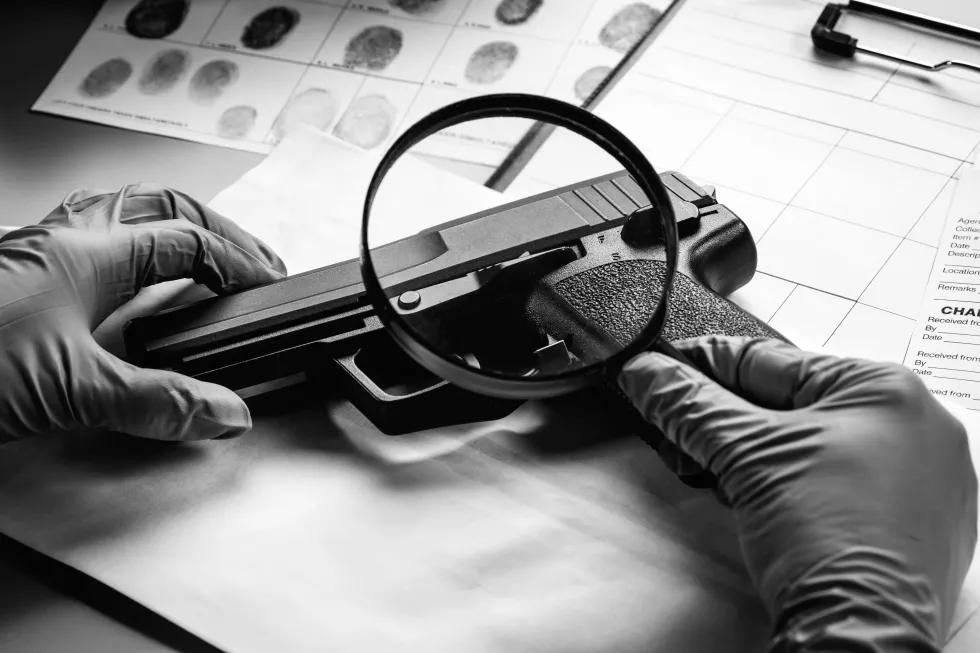 detective-through-magnifying-glass-looking-evidence