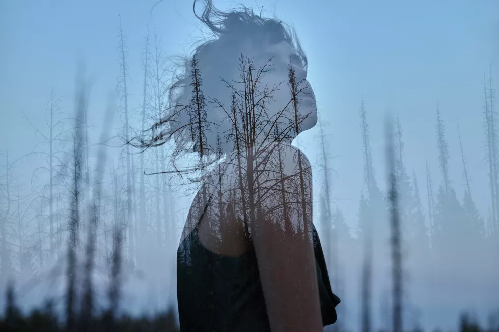 portrait-girl-with-double-exposure-against-tree-crown-delicate-mysterious-portrait-woman-with-blue-sky-wood