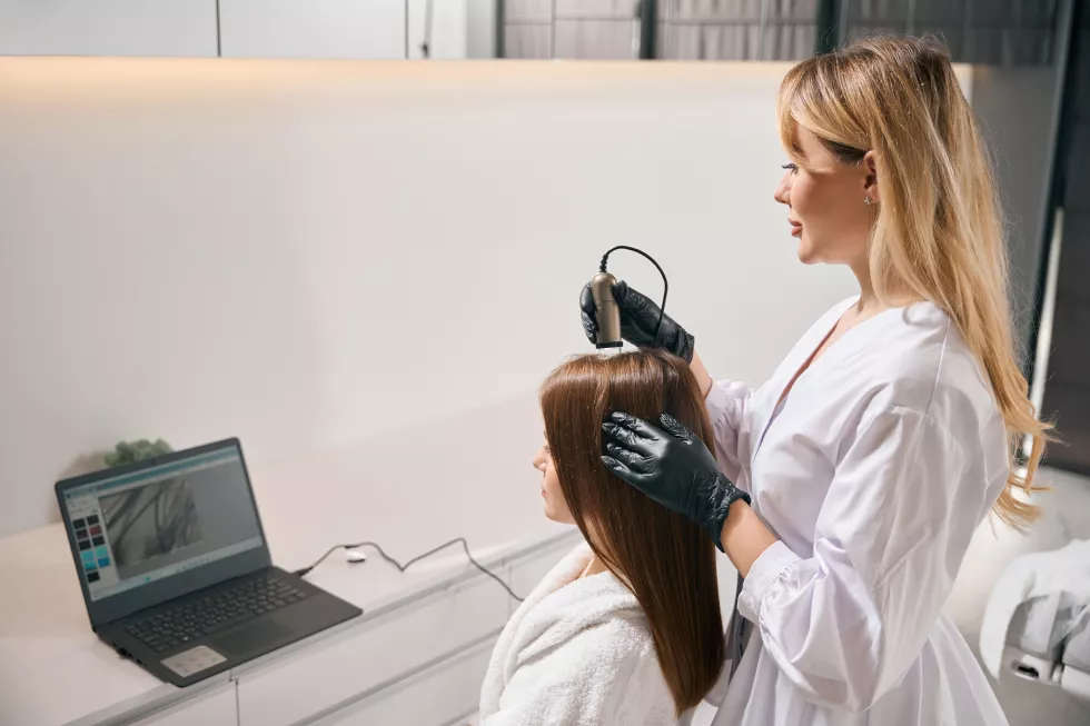 side-view-cosmetologist-doing-trichoscopy-watching-results-woman-hair