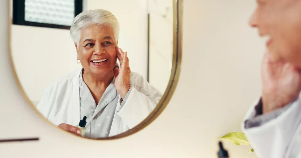 serum-skincare-mirror-with-old-woman-bathroom-beauty-anti-aging-cosmetics-collagen-treatment-facial-product-dermatology-with-elderly-person-home-glow-self-care