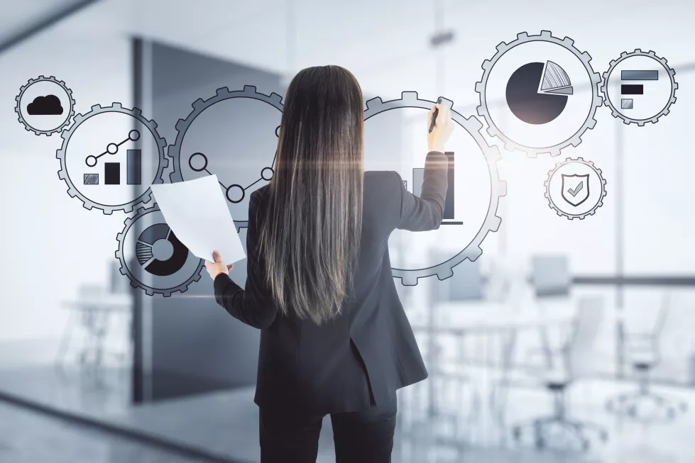 attractive-young-european-businesswoman-using-digital-cogwheel-business-interface-blurry-office-interior-background-future-ai-concept