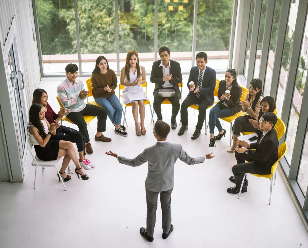 high-angle-view-happy-business-people-office-meeting