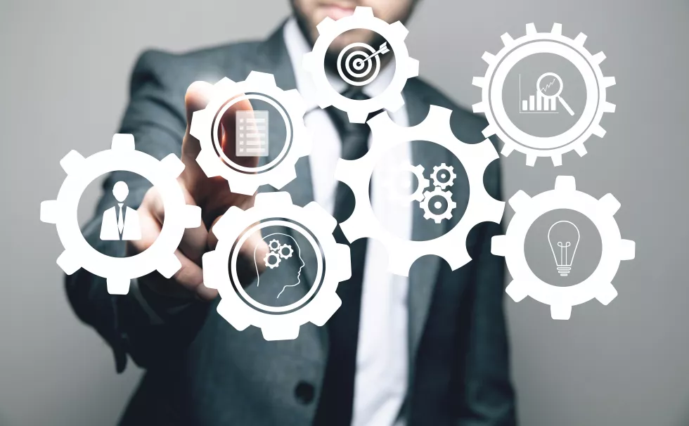 gears-mechanism-business-man-tapping-screen