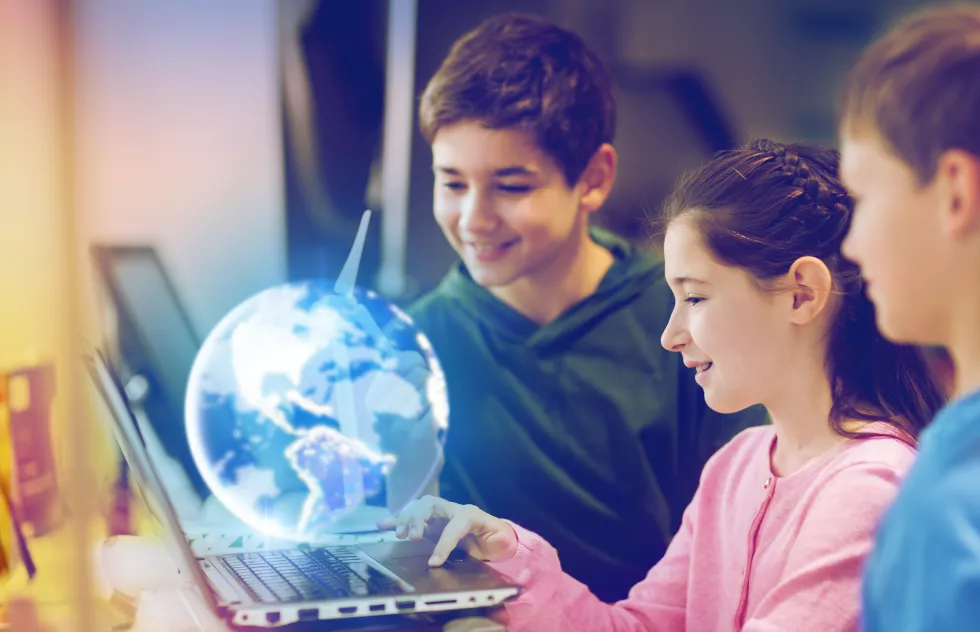children-with-laptop-earth-planet-hologram