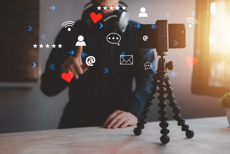 man-is-streaming-live-content-online-with-smartphone-home-room-streamer-with-headphone-talk-with-listening-audience-new-concept-vlog