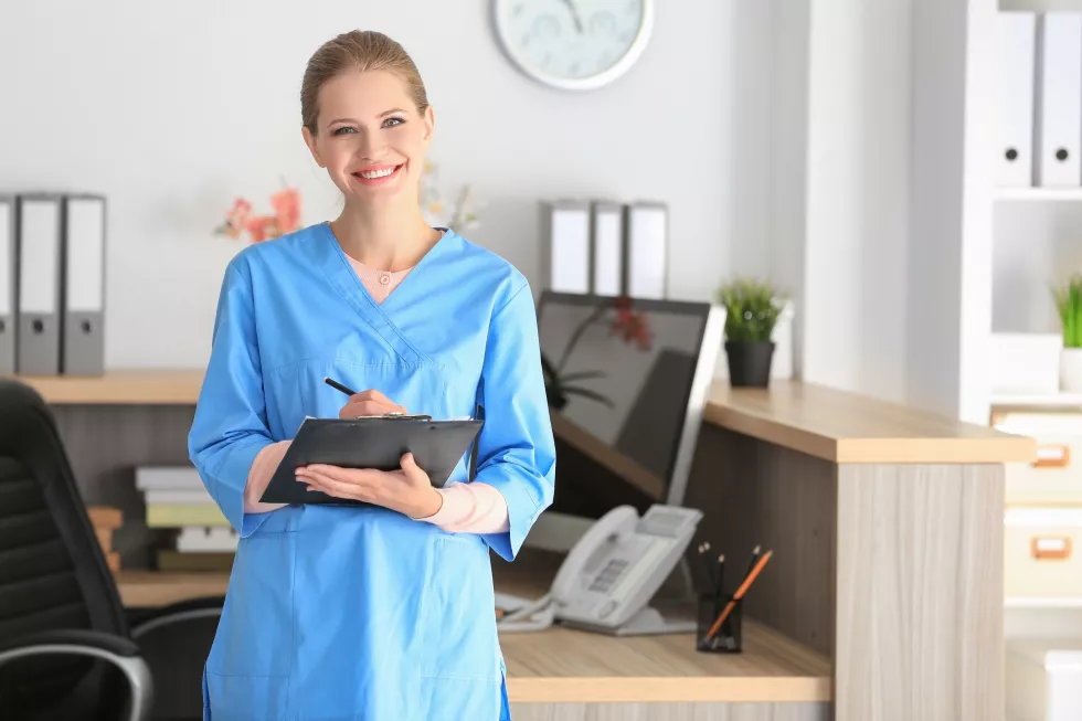young-female-receptionist-holding-folder-with-documents-hospital