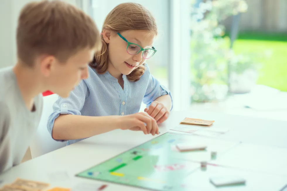 rear-view-father-girl-looking-table