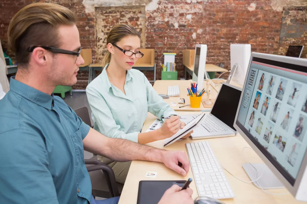 casual-photo-editors-using-computer-office