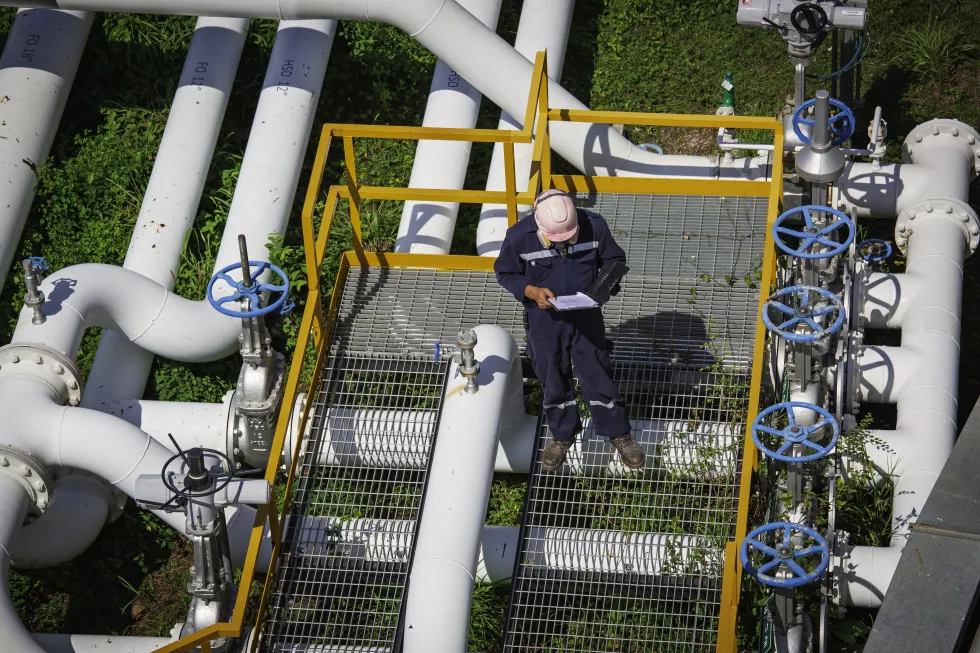 top-view-male-worker-inspection-valve-visual-check-record-pipeline-oil-gas-industry