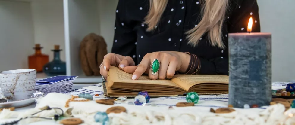 woman-fortune-teller-reads-book-spells-selective-focus