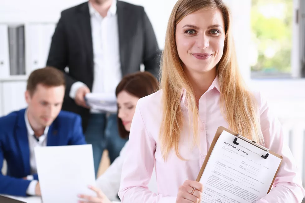beautiful-smiling-cheerful-girl-workplace-look-camera