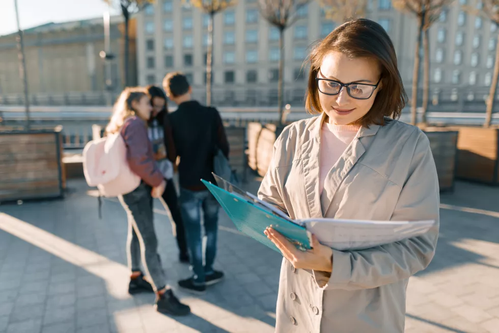 portrait-mature-smiling-female-teacher