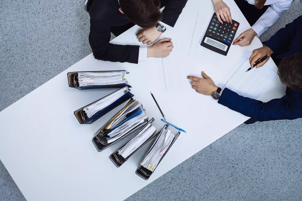 business-people-meeting-view-from-bookkeeper-financial-inspector-making-report-calculating-checking-balance-internal-revenue-service-checking-financial-document-audit-tax-conce