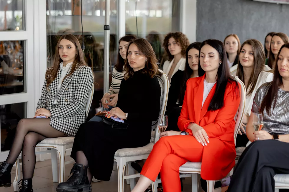group-women-sit-row-one-which-is-wearing-red-suit