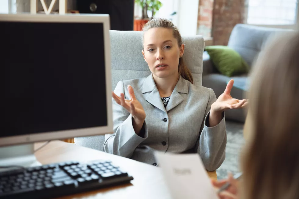 young-woman-sitting-office-job-interview-with-female-employee-boss-hr-manager-talking-thinking-looks-confident-concept-work-getting-job-business-finance-communication