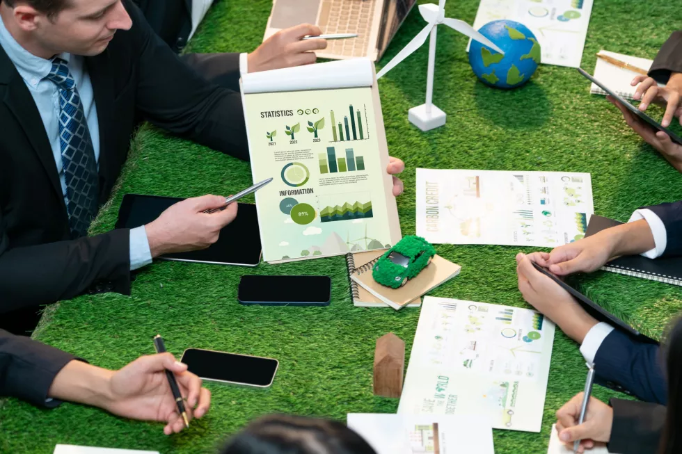 diverse-group-business-people-planning-alternative-energy-utilization-greener-sustainable-earth-by-reducing-co2-emission-carbon-credit-with-renewable-clean-energy-technology-quaint