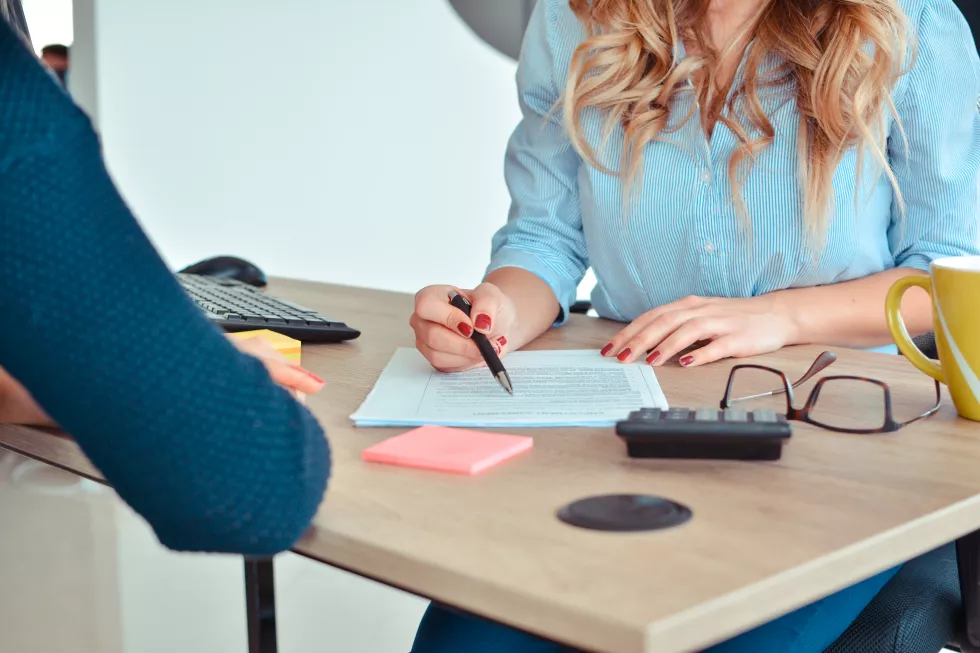 midsection-businesswomen-working-desk-office