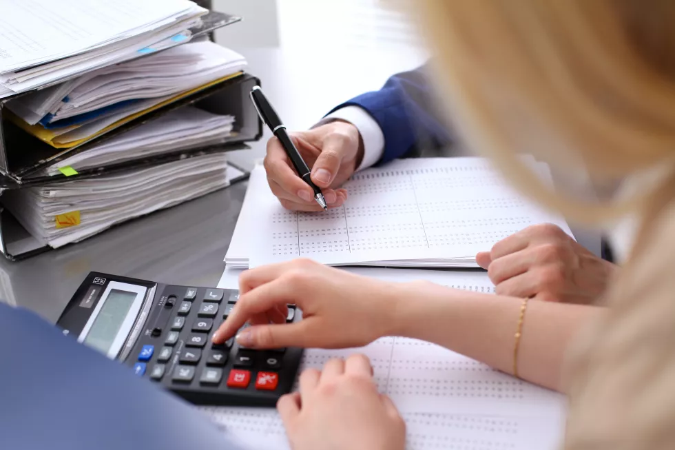 bookkeeper-financial-inspector-secretary-making-report-calculating-checking-balance-internal-revenue-service-inspector-checking-financial-document-audit-concept