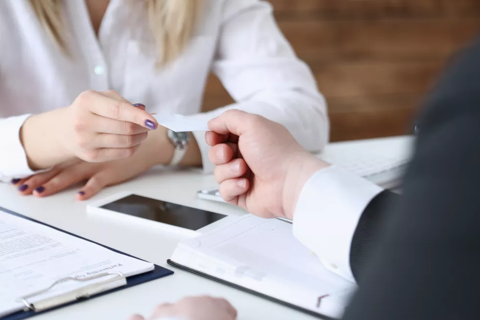 female-hand-suit-give-blank-calling-card-male-visitor-closeup-white-collar-partners-company-name-exchange-executive-ceo-introducing-conference-product-consultant-sale-clerk-concept