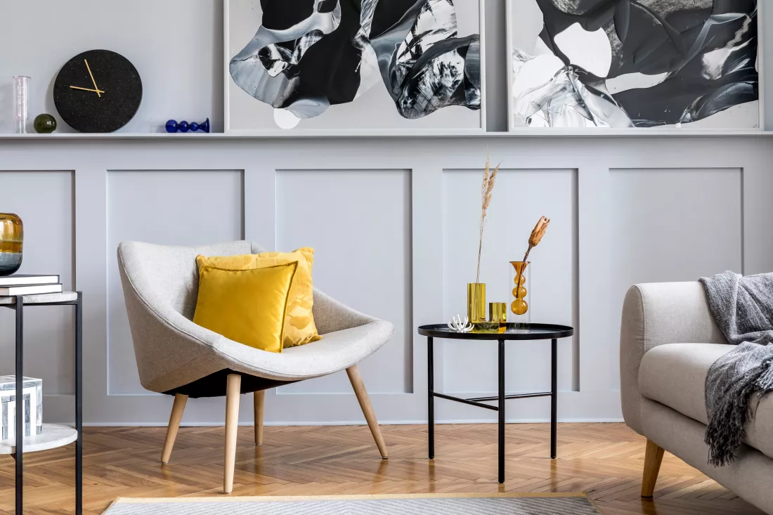 stylish-scandinavian-home-interior-living-room-with-design-gray-sofa-armchair-marble-stool-black-coffee-table-modern-paintings-decoration-plant-elegant-personal-accessories-home-decor