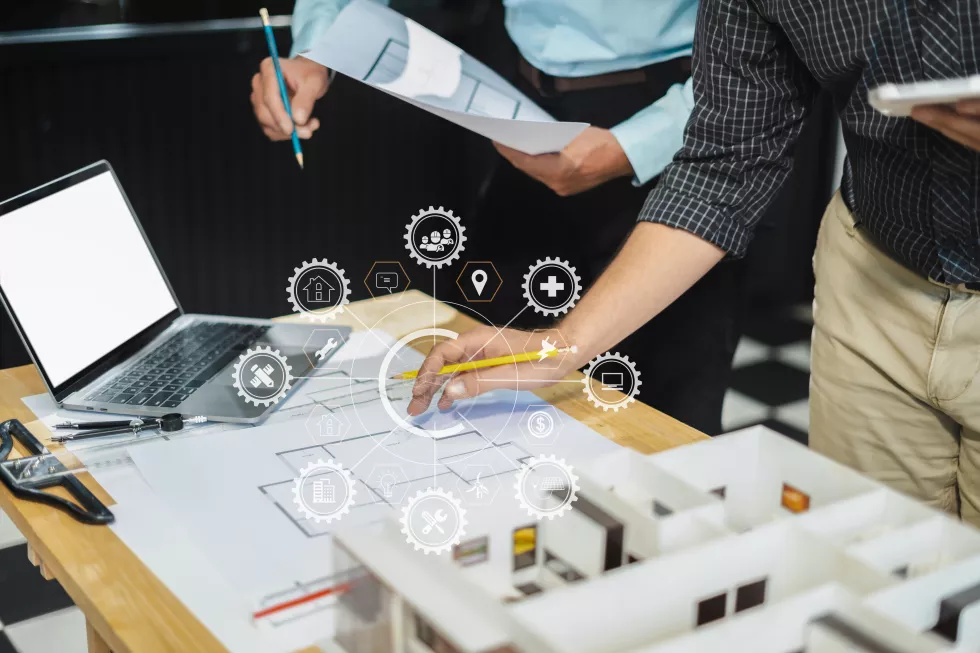 architect-caucasian-man-working-blueprint-meeting-project-working-with-partner-model-building-company-office