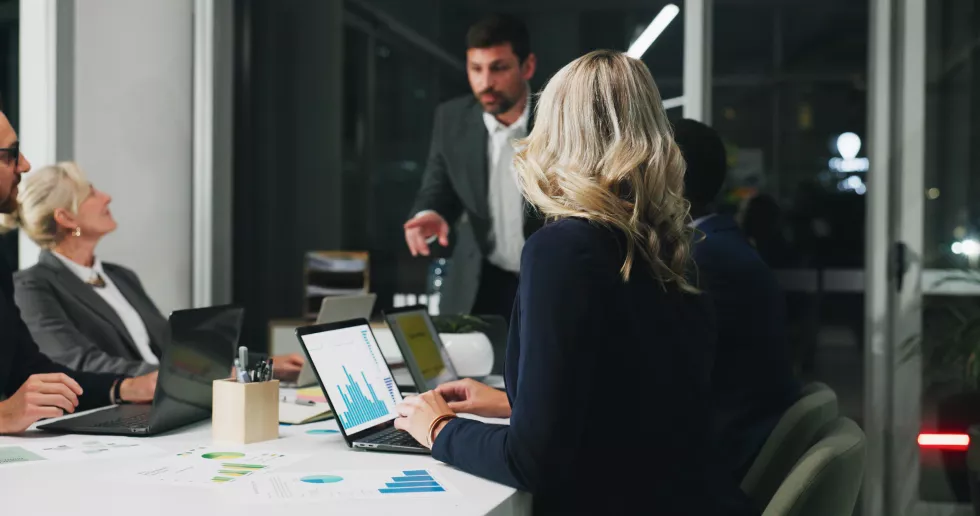 night-meeting-woman-office-with-laptop-business-people-graphs-digital-agency-technology-overtime-team-with-planning-management-review-paperwork-working-late-report