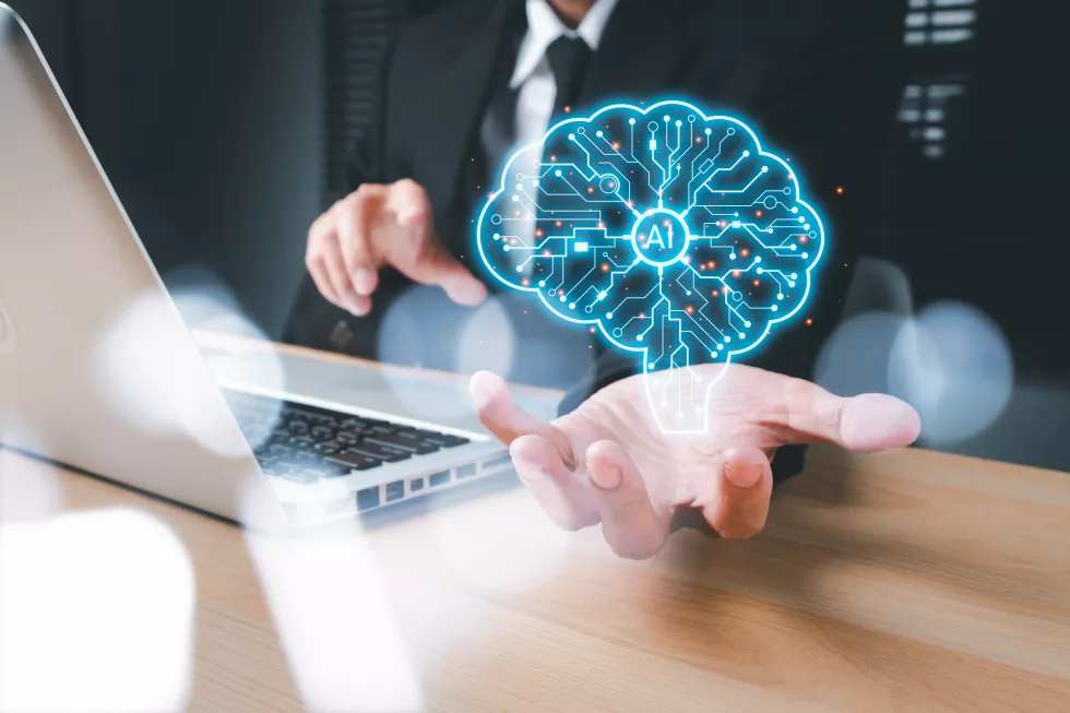 midsection-man-using-smart-phone-table