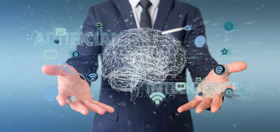 businessman-holding-artificial-intelligence-with-brain-app