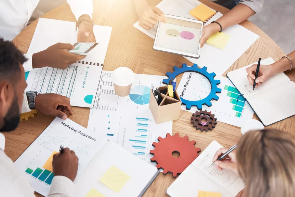 architects-drawings-engineers-planning-brainstorming-session-new-construction-project-team-young-engineers-measuring-analyzing-plans-new-development