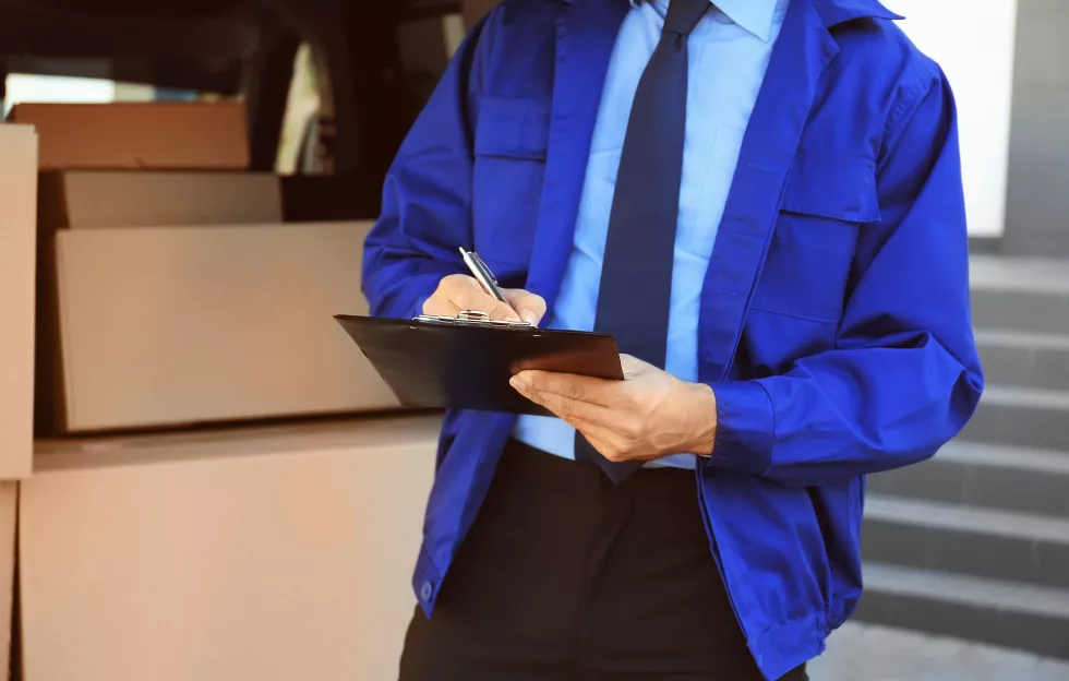 delivery-man-checking-list-clipboard