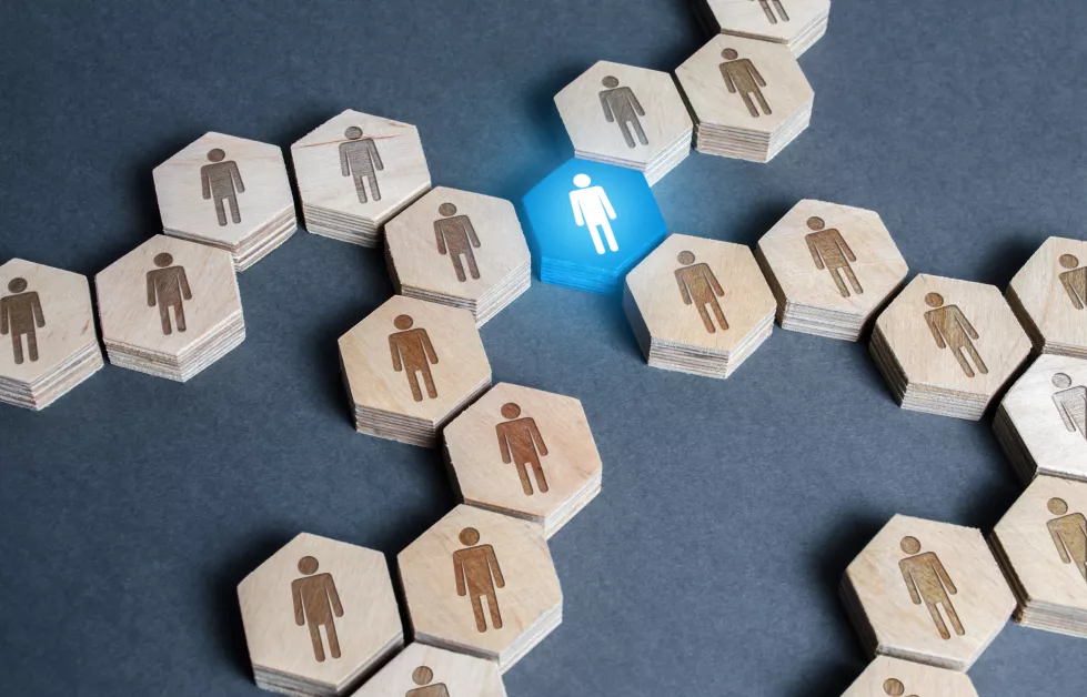 blue-human-figurine-connects-employees-into-large-company-network-connection-system