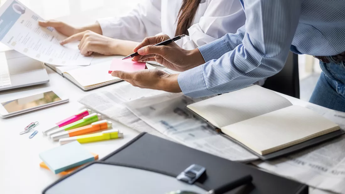 midsection-men-working-table
