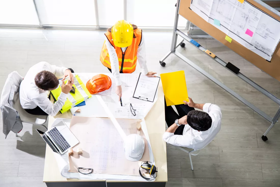 top-view-group-engineers-discussion-planning-about-project-be-made-table