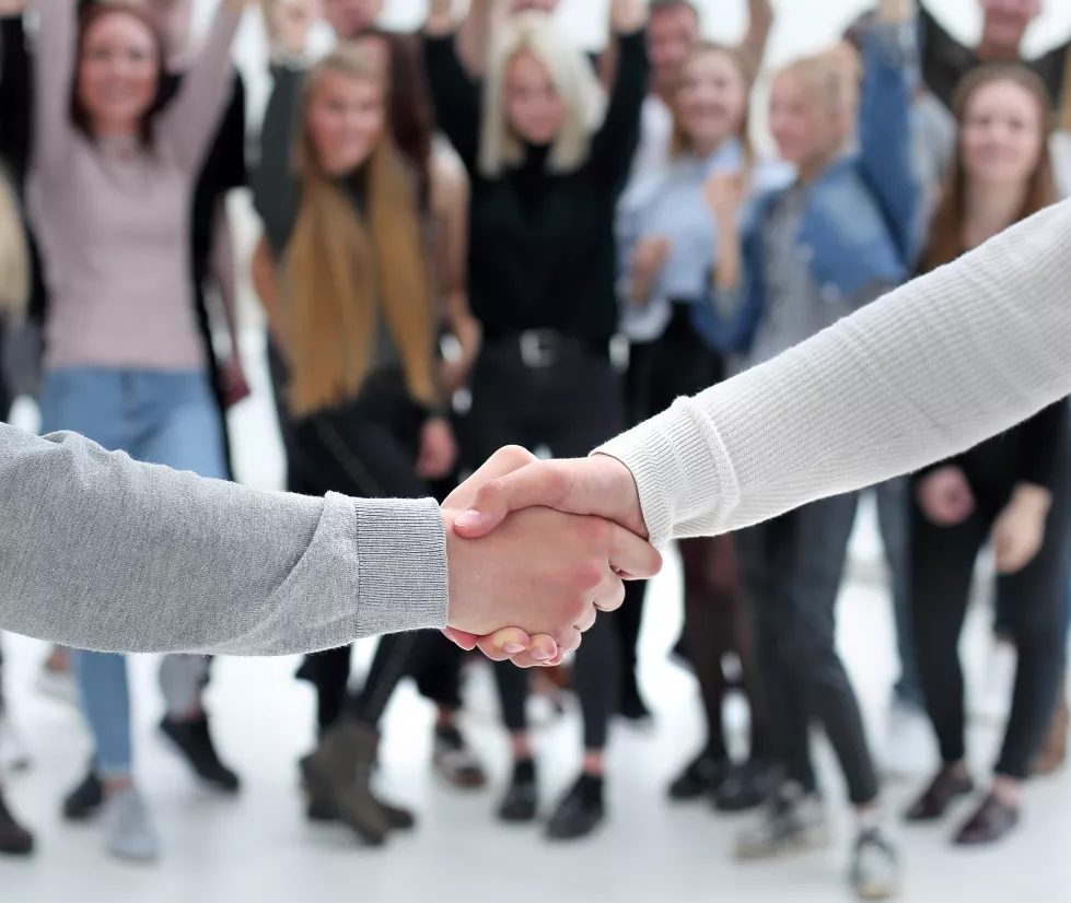 young-business-people-shaking-hands-with-each-other