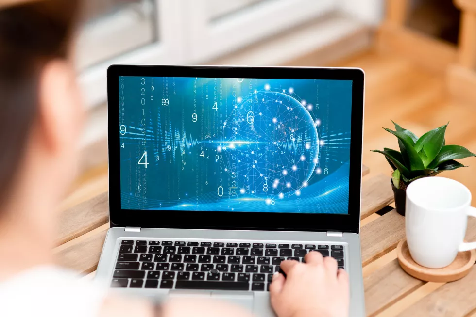 high-angle-view-man-using-laptop-table