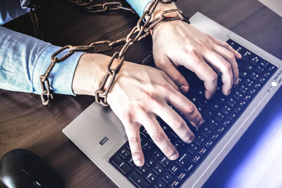 man-s-hands-old-rusty-chains-trap-office-work-routine-job-manager-near-laptop