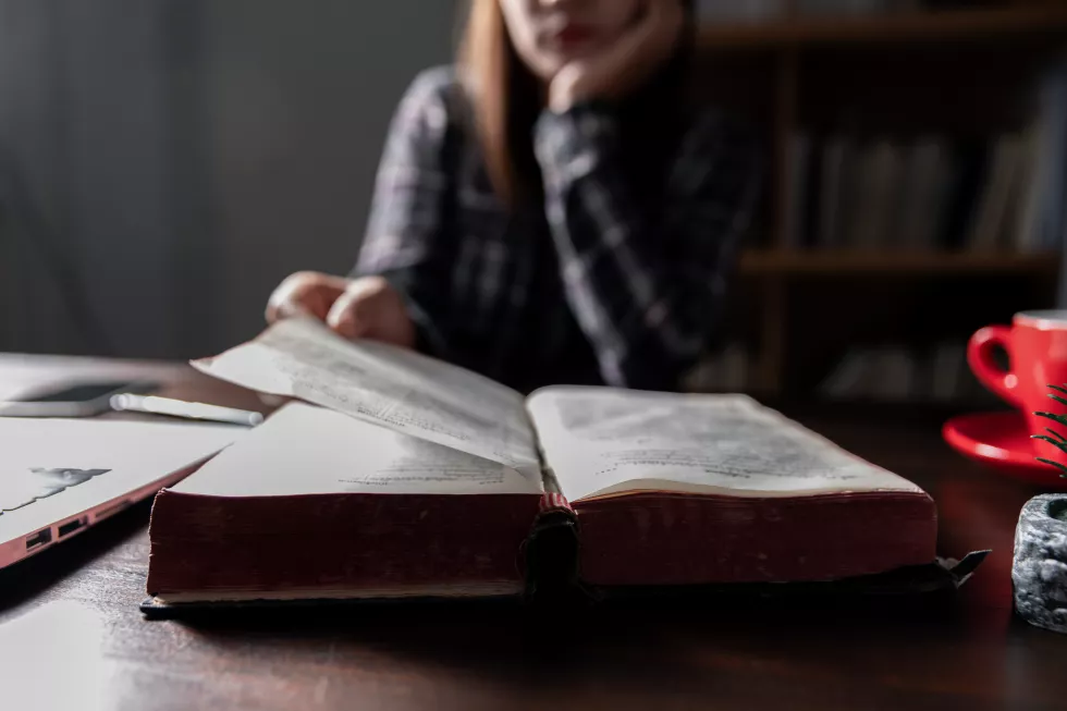 christian-online-technology-concept-hands-praying-christian-with-digital-computer-laptop-online-live-church-sunday-service-asian-catholic-man-are-reading-holy-bible-book-online-study