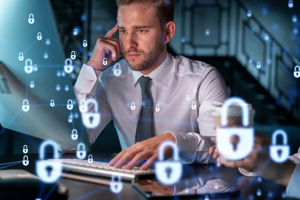 two-colleagues-working-together-protect-clients-confidential-information-cyber-security-it-hologram-padlock-icons-modern-office-background-night-time