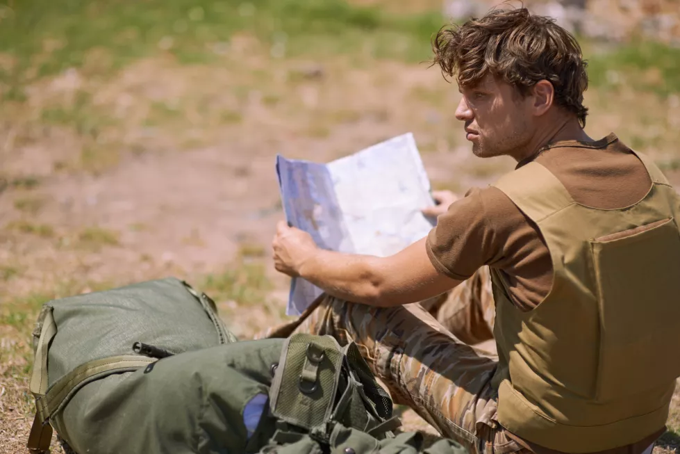 soldier-with-map-battlefield-planning-battle-location-tactical-operation-goals-mission-war-man-is-outdoor-military-base-camp-check-strategy-paperwork-with-army-target-attack