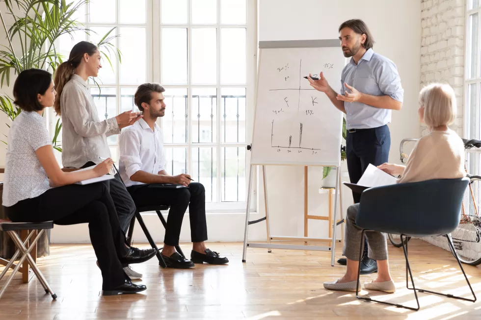 male-ceo-speak-multiethnic-staff-presenting-new-corporate-strategy