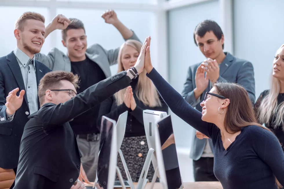 happy-employees-giving-each-other-high-five