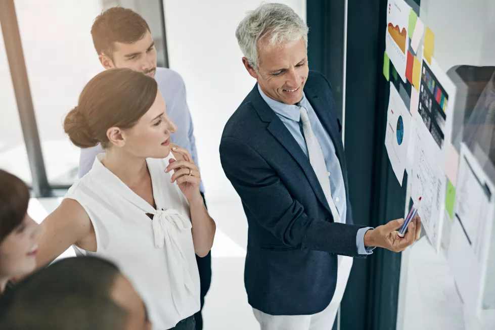 presentation-glass-wall-team-business-people-training-brainstorming-risk-management-analysis-strategy-group-writing-solution-paper-planning-happy-ceo-coaching-office