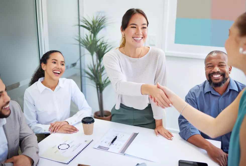 business-people-handshake-finance-meeting-team-promotion-onboarding-welcome-company-asian-woman-shaking-hands-happy-congratulations-hiring-thank-you-with-deal-group