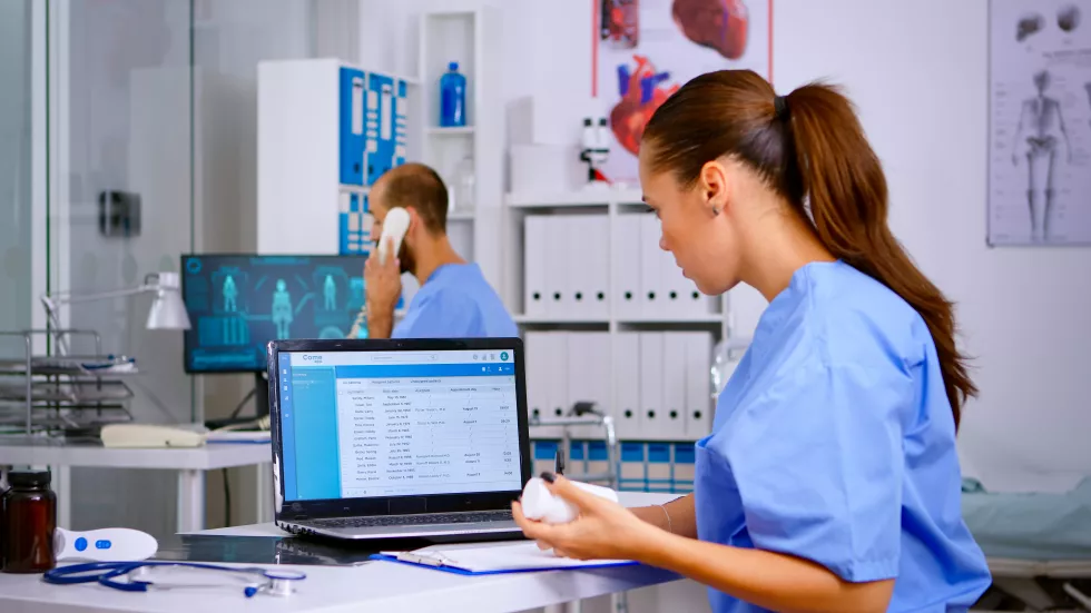 woman-using-mobile-phone-office