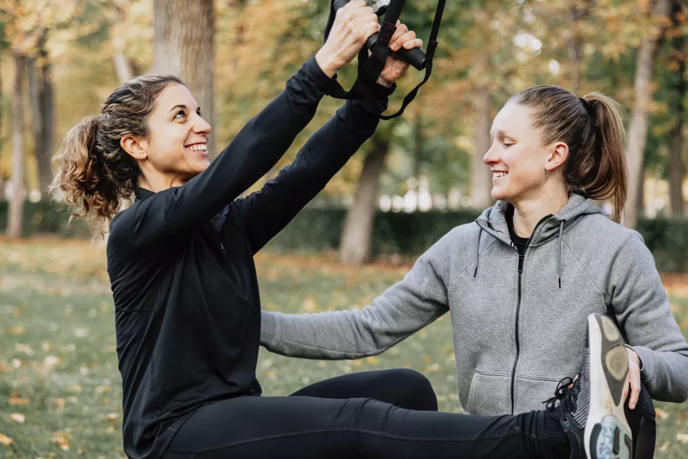 low-angle-view-women-exercising-park