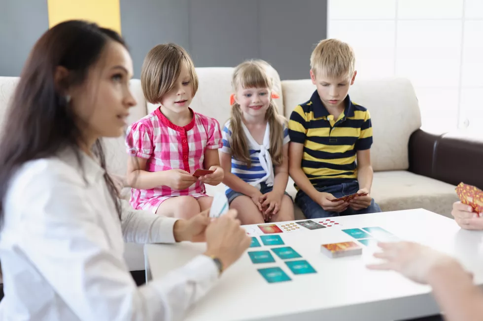 group-kids-spending-time-kindergarten-with-female-teacher