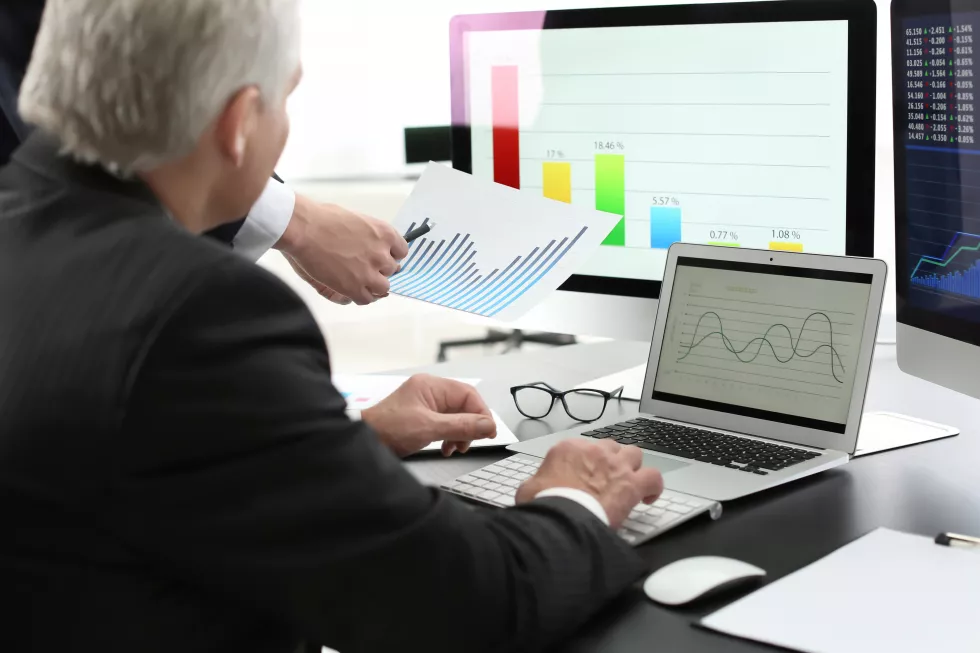 male-brokers-working-office-finance-trading-concept